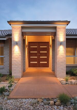 A new home with attractive outdoor lighting.